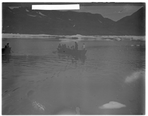Image of People in oomiak [umiak], another approaches